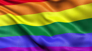 一面飄揚的彩虹旗，帶有鮮豔的條紋，象徵 LGBTQ 驕傲。 — 雙性戀旗幟 壁紙