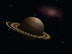一顆環狀行星漂浮在充滿星星的星系中，帶有宇宙塵埃。 — 土星 壁紙