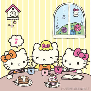 三個Hello Kitty角色在室內吃早餐，有煎餅和杯子蛋糕。 — iPad Air 13 壁紙