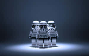 三個LEGO風暴兵在深色表面上被聚光燈照亮。 — 樂高 壁紙
