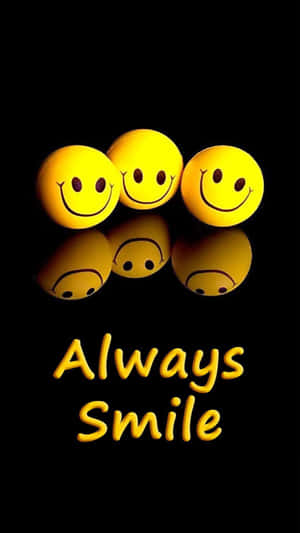 三個黃色笑臉球帶有反射，黑色背景上寫著 'Always Smile' 文字。 — 快樂 壁紙