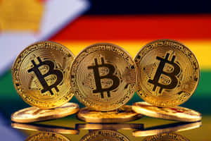 三枚金色比特幣硬幣，背景為德國國旗及倒影。 — 比特幣 GIF 壁紙