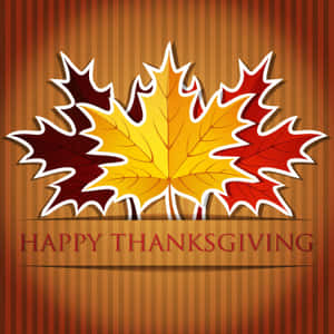 三片彩色楓葉，上面寫著happy thanksgiving。 — iPad Pro 13 壁紙