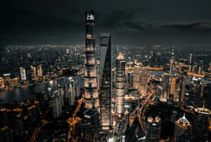 夜間上海天際線，閃耀的摩天大樓與河流 — 城市風景 壁紙