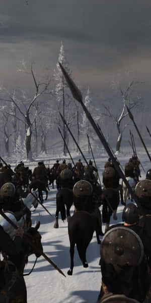 中世紀騎士騎馬高舉長矛衝過雪地森林。 — 電玩遊戲 GIF 壁紙