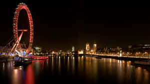 倫敦天際線夜景，倫敦眼和大笨鐘在泰晤士河上亮起。 — 城市風景 壁紙