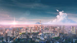 日落時分的東京天際線，東京鐵塔被照亮，天空中有雲。 — 城市 壁紙