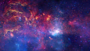 充滿活力的宇宙星雲，帶有旋轉的紅色、紫色和藍色，點綴著發光的星星。 — 宇宙 壁紙