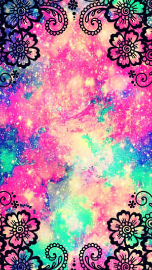 宇宙星雲，閃爍的星星被黑色花卉和佩斯利圖案框住，採用霓虹色。 — 酷炫美學 壁紙