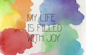 彩色水彩背景，文字為 my life is filled with joy — 肯定語 壁紙