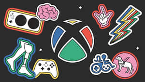 一系列色彩繽紛的遊戲和無障礙主題貼紙，帶有 Xbox 標誌。 — 慶祝 壁紙