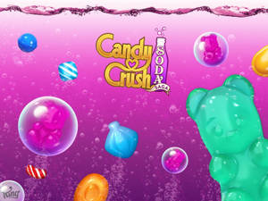 Candy Crush Soda Saga 標誌，漂浮在粉紅色汽水氣泡中的軟糖熊和糖果。 — 可愛 壁紙