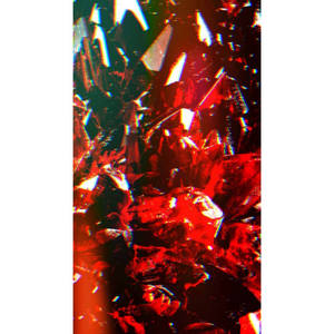 紅色和黑色碎玻璃的特寫，帶有銳利的光線反射。 — 壞女孩美學 GIF 壁紙