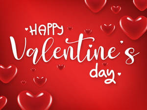 Happy Valentine's Day 文字被漂浮的紅色心形包圍在紅色背景上。 — 情人節快樂 壁紙