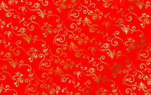 帶有金色漩渦花卉圖案的紅色背景，用於裝飾。 — 金色美學 壁紙