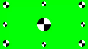帶有黑白棋盤格圓圈的綠色屏幕。 — 綠色 壁紙
