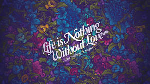 帶有白色草書引文「Life is Nothing Without Love」的花卉壁紙。 — 愛情語錄 GIF 壁紙
