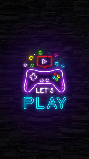 石牆上帶有 'LET'S PLAY' 字樣的霓虹遊戲控制器標誌。 — 深色霓虹 iPhone 壁紙