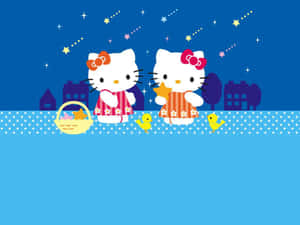 兩個穿著睡衣的Hello Kitty角色，在星空下手持星星和裝有小雞的籃子。 — Hello Kitty 萬聖節 壁紙