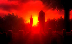 兩個人物在火紅天空下的夕陽墓地中站立。 — 陰屍路 GIF 壁紙