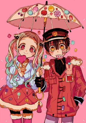 兩個動漫角色在粉紅色冬季場景中拿著糖果雨傘和棒棒糖。 — 櫻島麻衣 壁紙