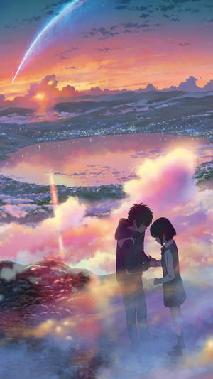 兩個動漫角色在夕陽下的懸崖上牽手，背景是發光的湖泊和彗星。 — 你的名字 GIF 壁紙