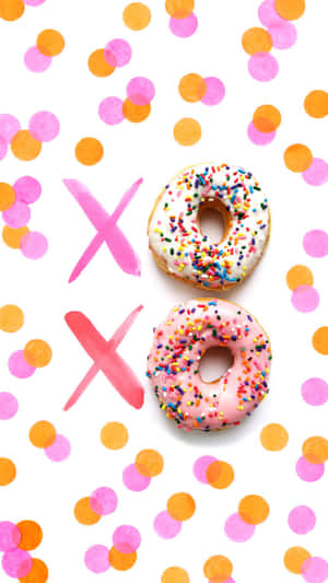 兩個撒有糖霜的甜甜圈，背景是五彩紙屑和X標記。 — Dunkin Donuts 壁紙