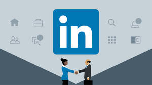 兩人在 LinkedIn 標誌下握手，周圍有商業圖標。 — 領英 壁紙