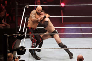 兩名摔角手在比賽中於摔角擂台內交戰。 — WWE GIF 壁紙
