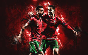 兩名身穿紅綠球衣的足球員舉起手臂慶祝。 — FIFA 世界盃 壁紙