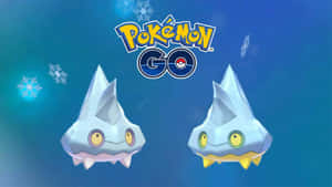 兩隻冰屬性寶可夢在雪景藍色場景中漂浮，帶有Pokémon GO標誌。 — 電玩遊戲 GIF 壁紙