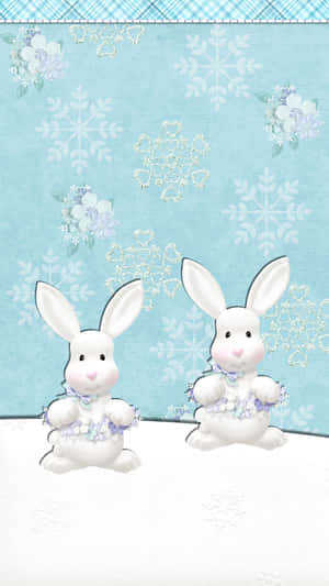 兩隻戴著花卉蝴蝶結的白兔在雪地上，有雪花和花朵。 — 白兔 壁紙