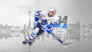 冰球運動員 Auston Matthews 在多倫多天際線和 CN 塔前滑冰。 — 運動 壁紙