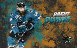 冰球運動員 Brent Burns 身穿青色鯊魚隊制服，手持球桿。 — 聖荷西鯊魚隊 壁紙