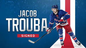 冰球運動員 Jacob Trouba 身穿 Rangers 球衣，手持球棍，帶有「Signed」文字。 — 紐約遊騎兵 壁紙