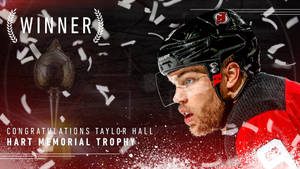 冰球運動員Taylor Hall在五彩紙屑飄落中慶祝贏得哈特紀念獎盃。 — 冰上曲棍球 GIF 壁紙
