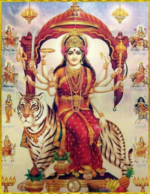 女神杜爾迦坐在老虎上手持武器，周圍有較小的神祇。 — Maa Durga 壁紙