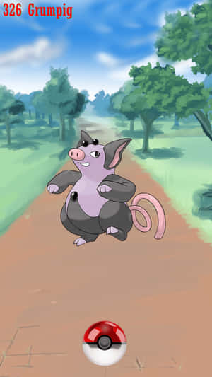 Grumpig 站在森林中的泥土小徑上，下方有一個精靈球。 — 電玩遊戲 GIF 壁紙