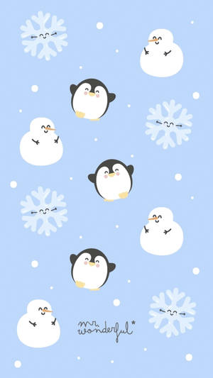 可愛的企鵝和雪人帶著笑臉漂浮在雪景中。 — 雪 壁紙