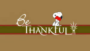 史努比拿著一顆紅心，旁邊有「Be THANKFUL」文字和小麥稈。 — 可愛感恩節 壁紙