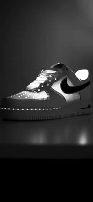 黑白工作室燈光下發光的LED Nike Air Force 1運動鞋。 — Galaxy A54 壁紙
