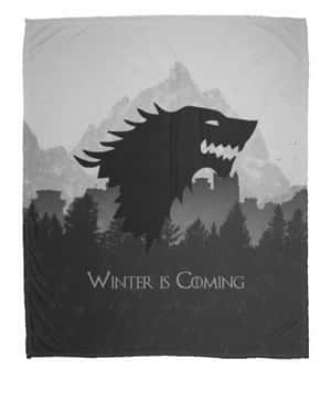灰色刷毛毯上的冰原狼剪影，附有「Winter is Coming」文字。 — 桌面 壁紙
