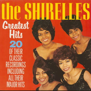 The Shirelles Greatest Hits 的復古專輯封面，四位微笑的女性身穿黑色亮片上衣。 — 音樂 壁紙