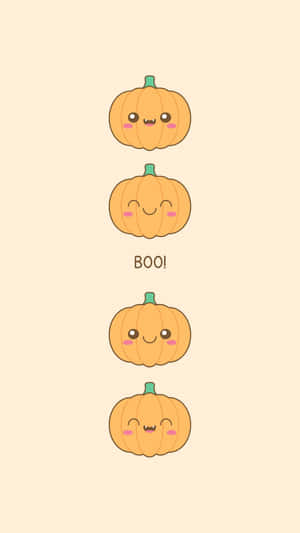 四個微笑卡通南瓜，有粉紅臉頰和綠色莖，其中一個帶有BOO!字樣 — 萬聖節 iPhone 壁紙