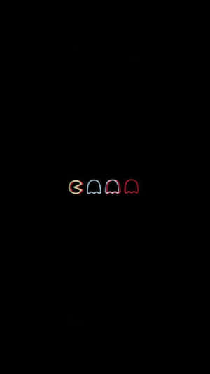 霓虹 Pac-Man 和鬼魂在黑暗背景中發光。 — 卡通 壁紙
