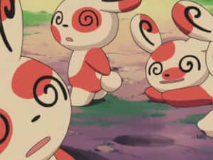 四隻帶有紅色漩渦圖案的捲捲耳寶可夢站在草地上。 — 卡通 壁紙