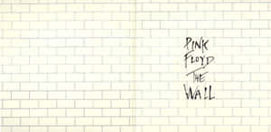 在奶油色磚牆上以黑色墨水寫成的Pink Floyd The Wall。 — 平克·弗洛伊德 壁紙