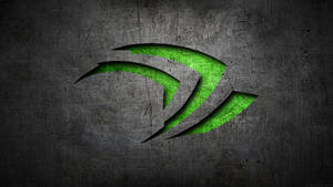 發光綠色NVIDIA標誌在帶有刮痕的深色金屬背景上。 — Nvidia GIF 壁紙