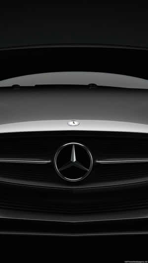 帶有鍍鉻星徽標的黑色賓士汽車水箱護罩特寫。 — Mercedes Benz C300 壁紙