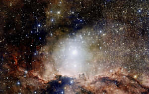 在深空中被無數星星環繞的發光星雲。 — 星際效應 壁紙